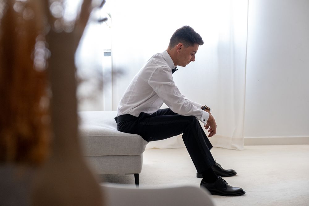 A series of elegant poses in a bright white room showcasing formal attire and classic style.