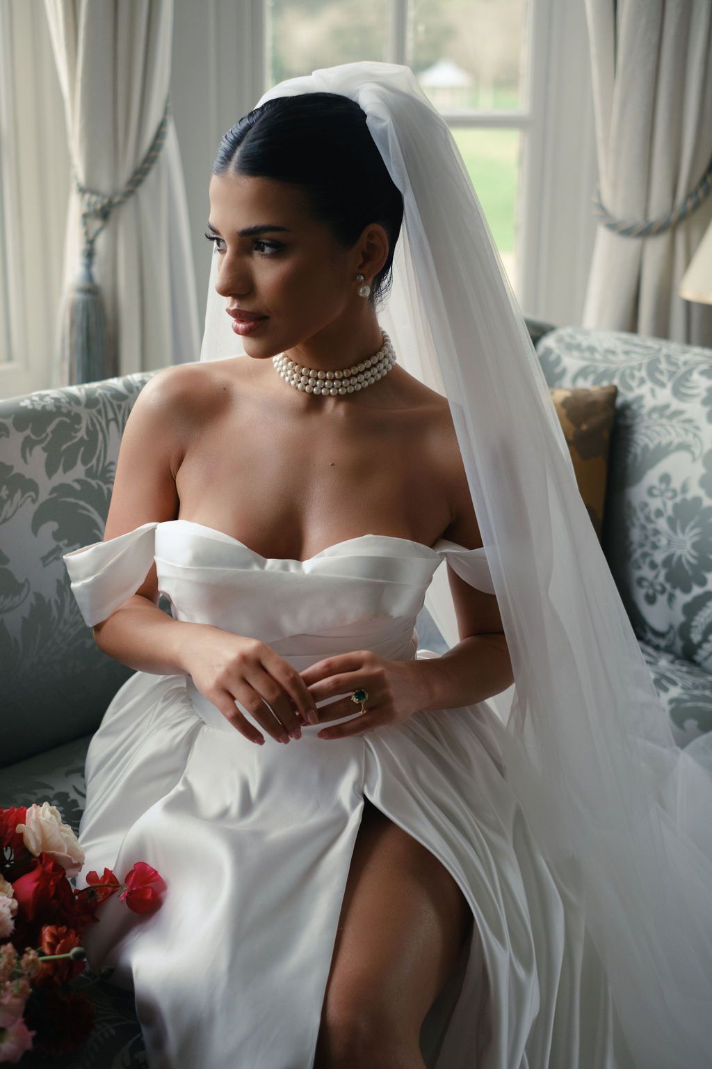 Classic bridal portraits featuring a strapless white wedding gown and flowing veil in an elegant indoor setting.