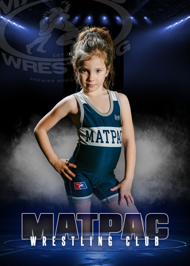 A young wrestler poses in a teal and white singlet against a dramatic dark backdrop with blue lighting effects.
