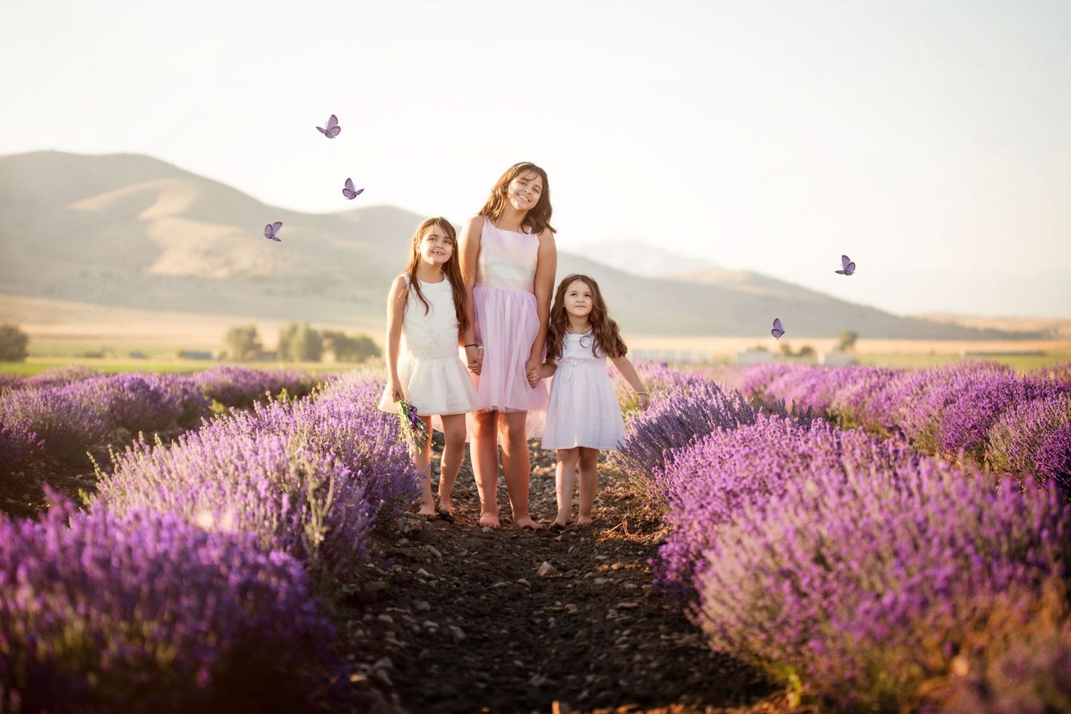 Girls in lavender fields Mona Utah Young Living Lavender Farm butterflies