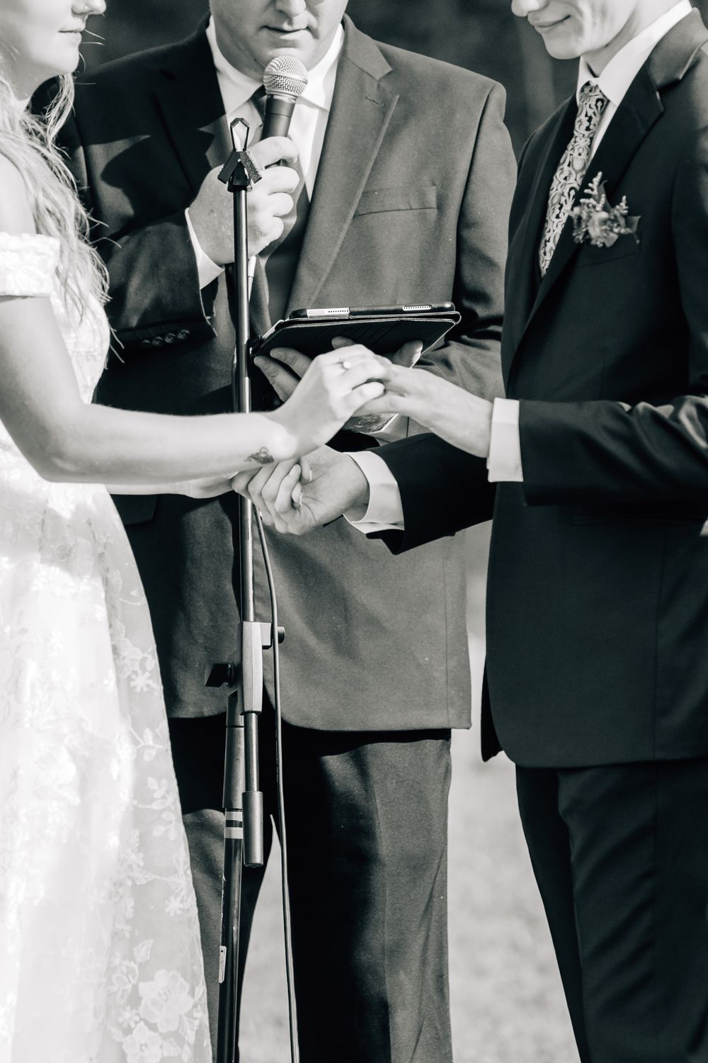 Black and white wedding ceremony photos showing exchange of vows.