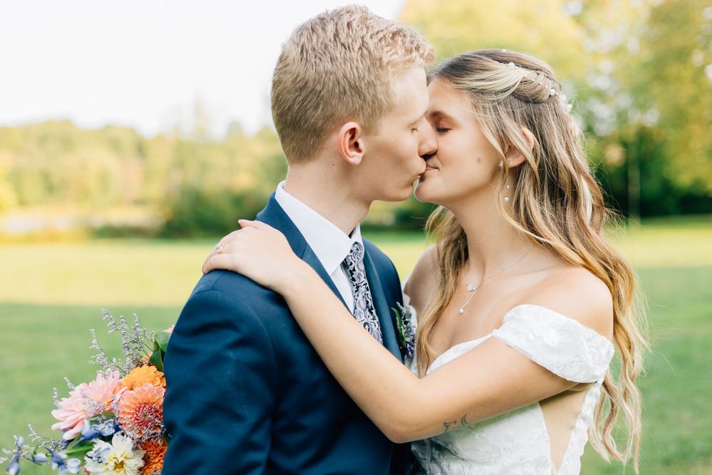 Tender wedding moment captured in a series of intimate outdoor portraits.