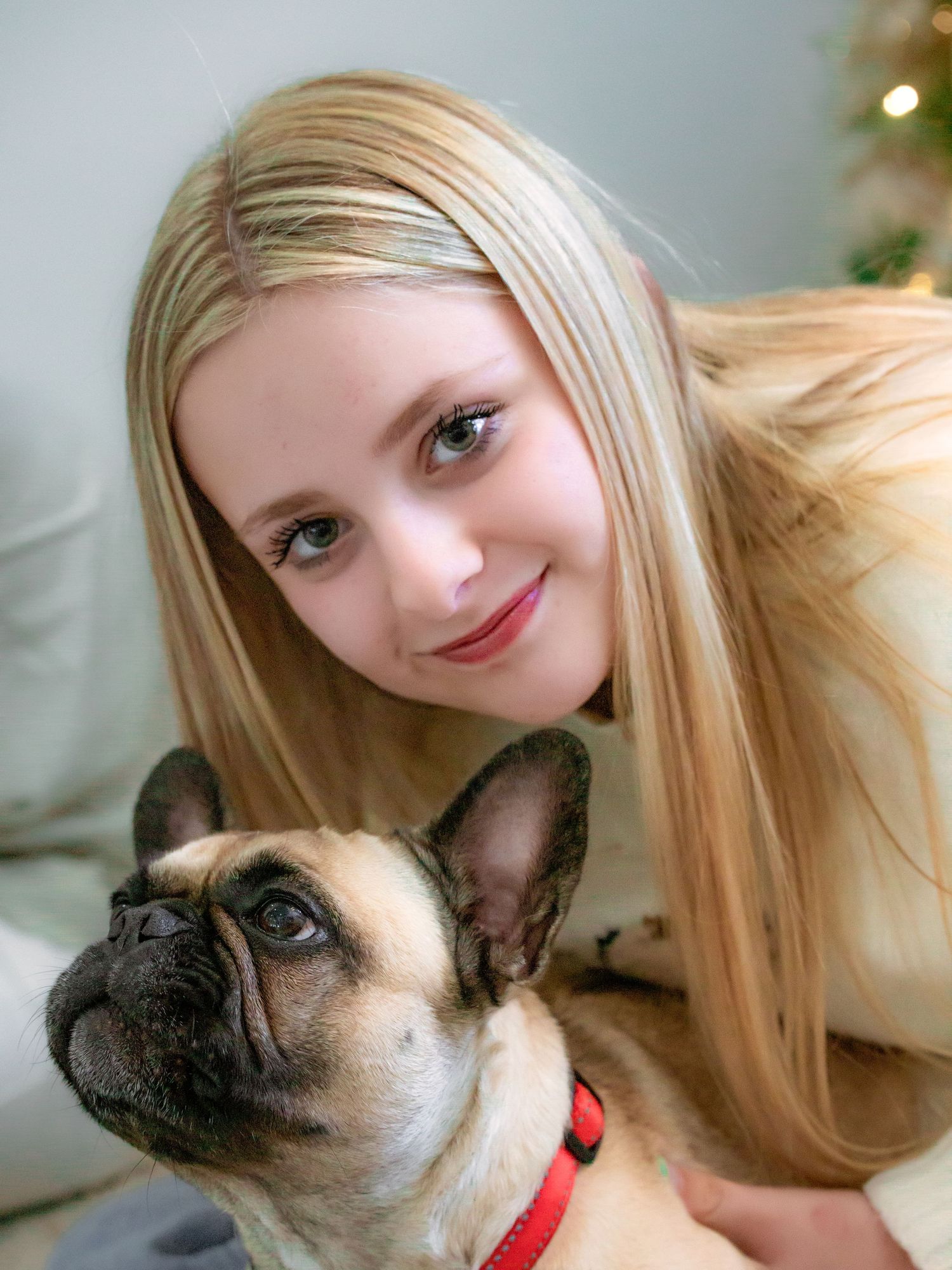A person with long blonde hair shares a series of sweet moments with their pug dog in close-up photos.