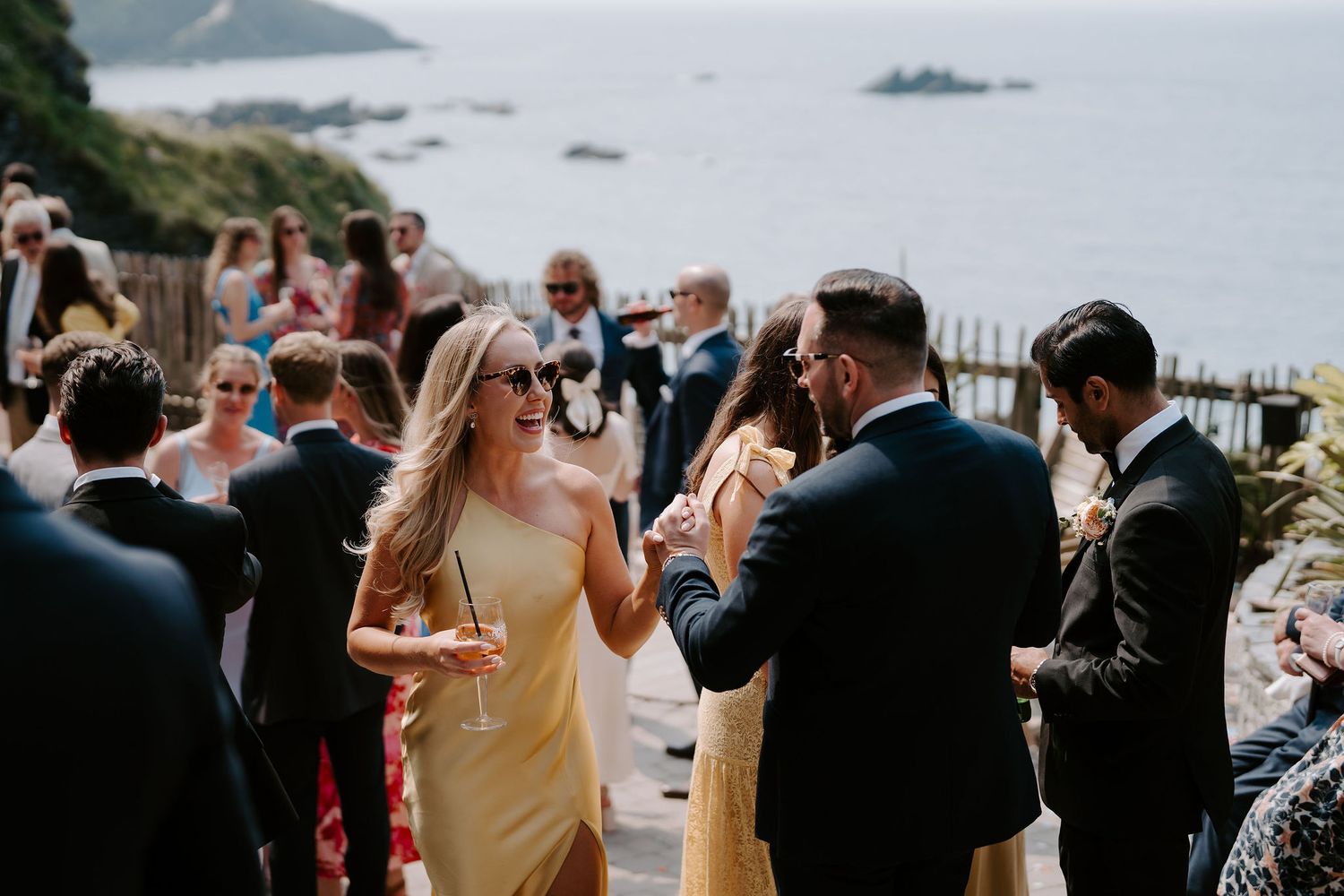 Wedding Guests enjoying drinks reception at Tunnels Beach Wedding Venue in North Devon