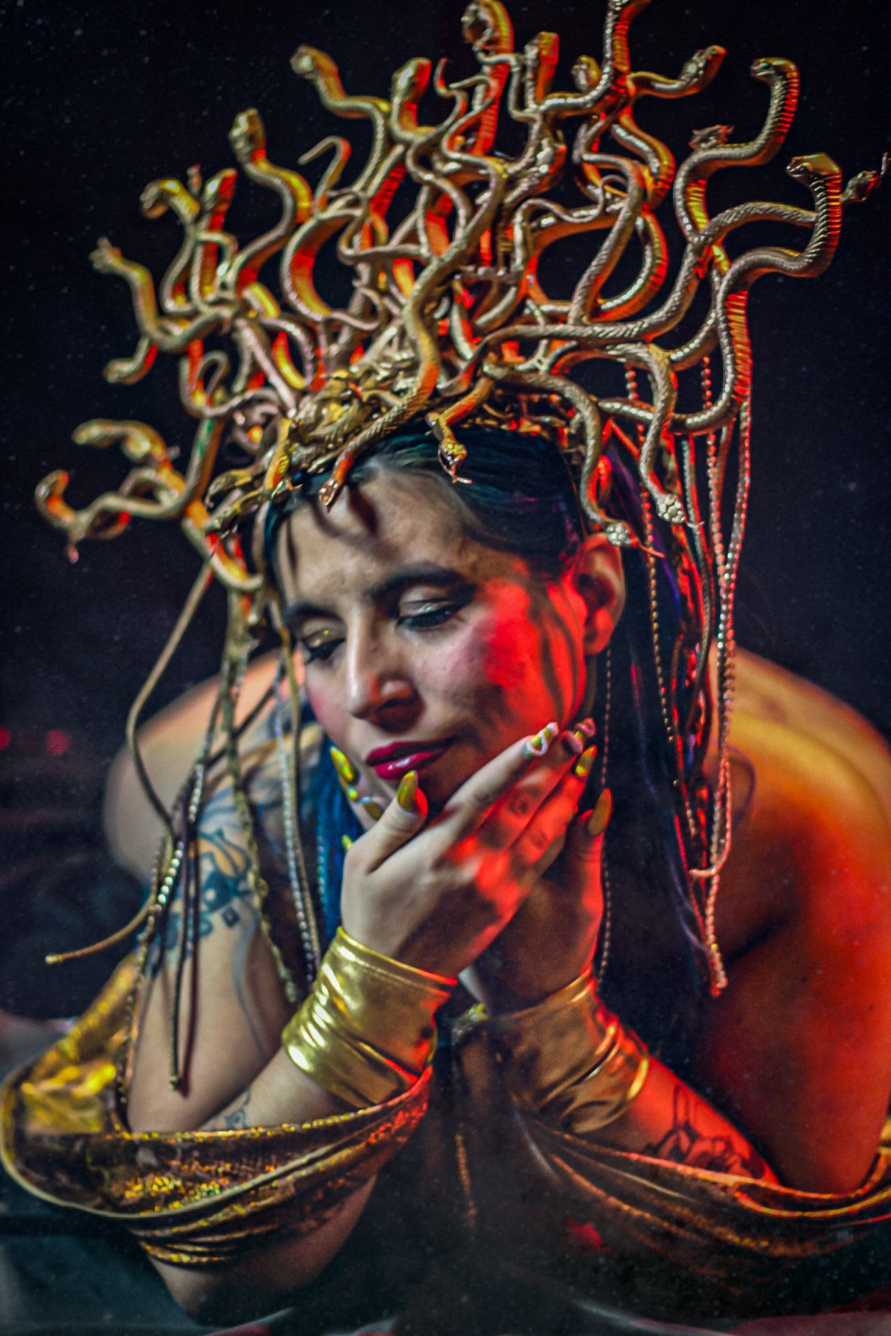 Artistic portrait sequence with intricate golden headdress and dramatic red lighting effects.