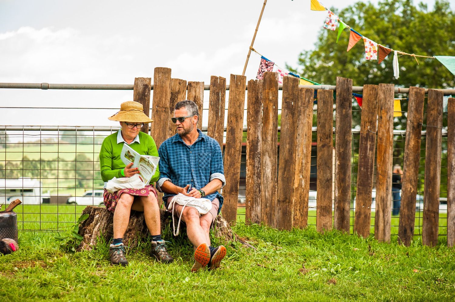 Dorrigo Folk and Bluegrass Festival attendees viewing their programme by Bellingen Shire Photographer