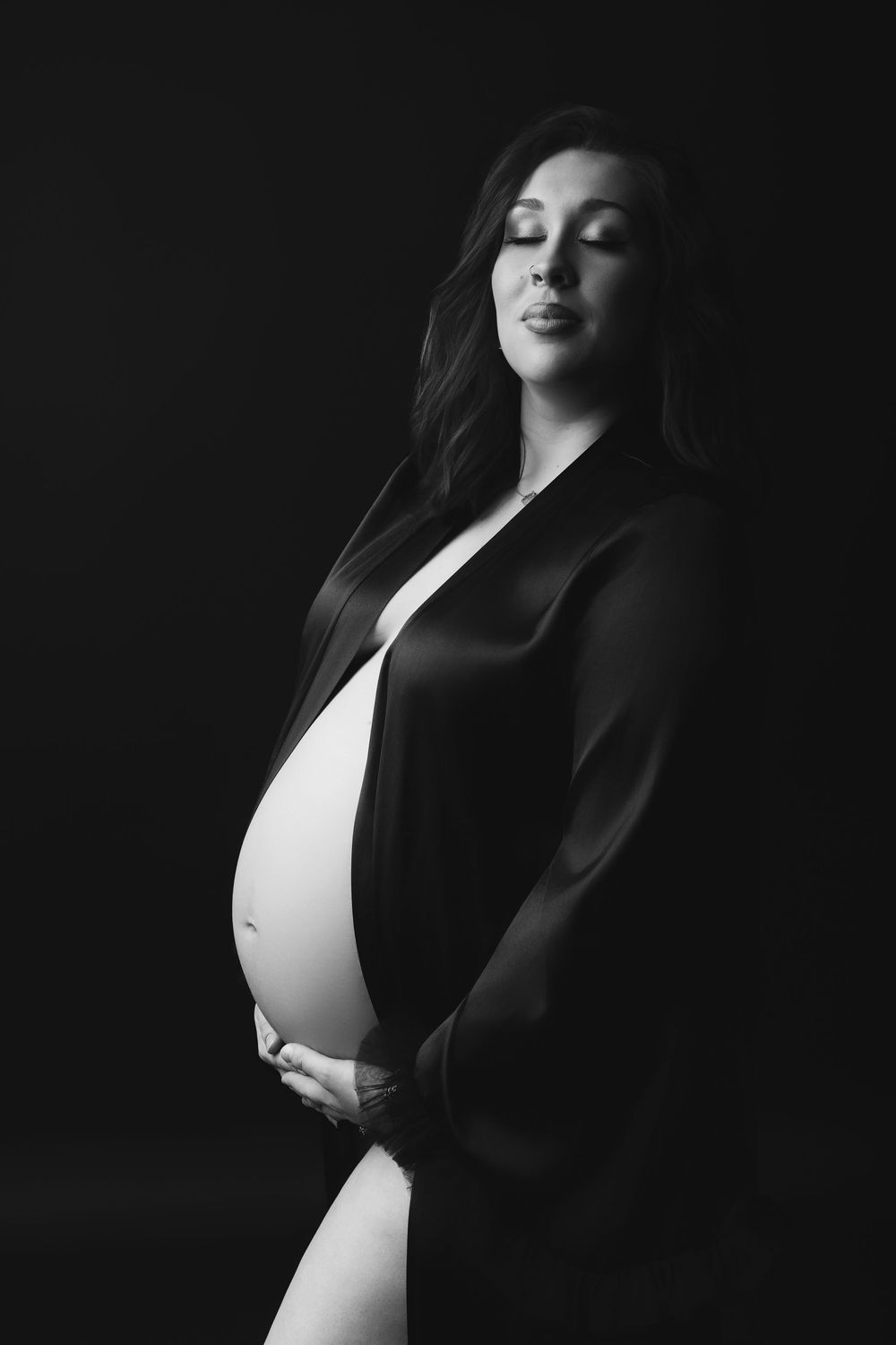 Black and white artistic portrait series showing dramatic lighting and shadows on a figure in dark clothing.