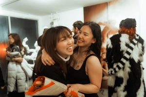Friends sharing a joyful moment at what appears to be a party or celebration.