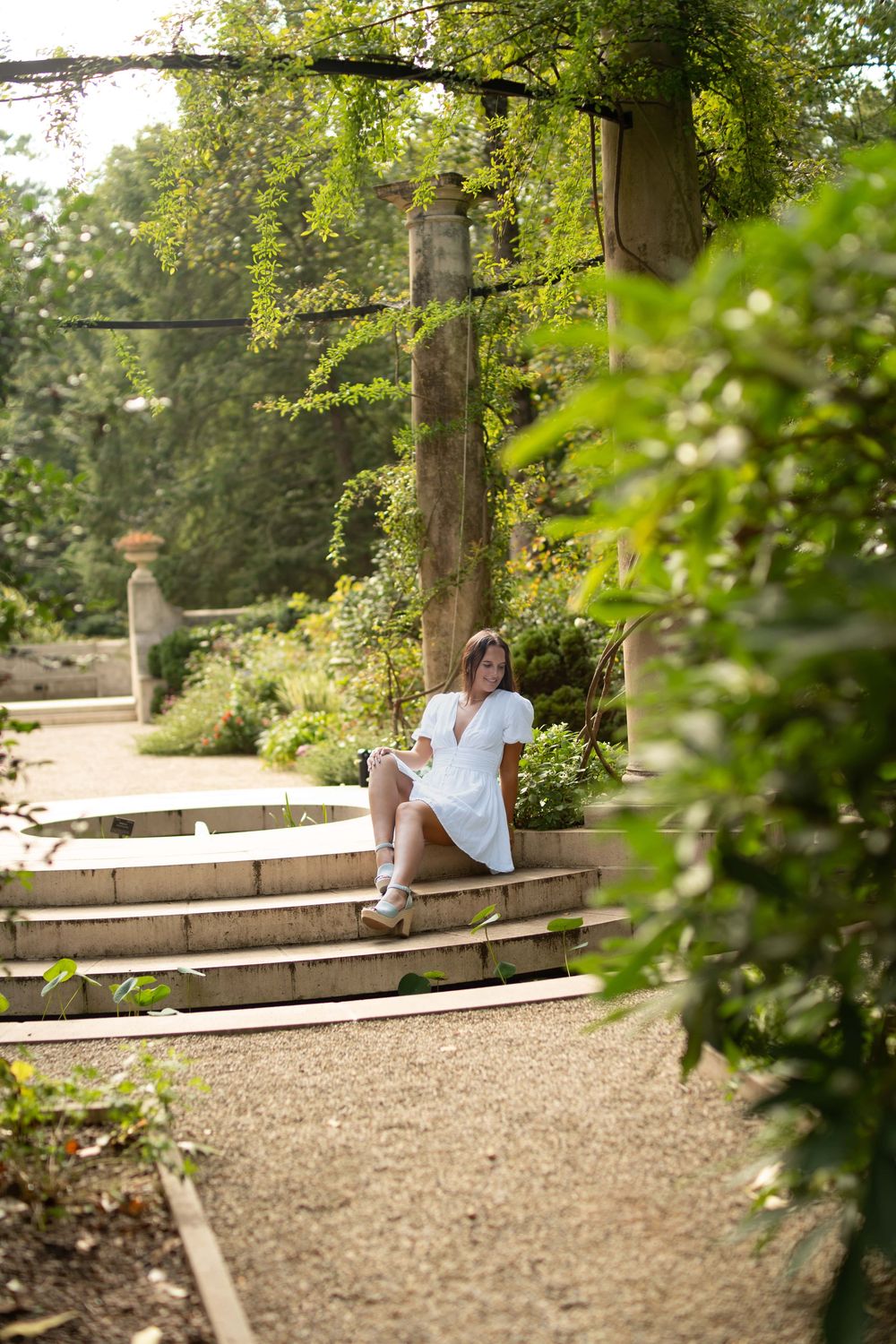 High school senior at the Atlanta History Center for senior photos under a canopy