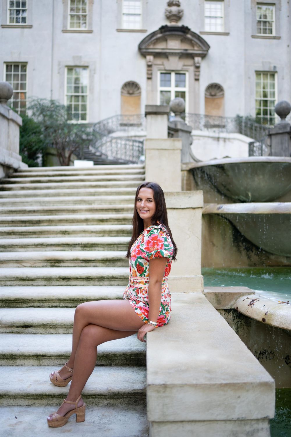 High school senior at the Atlanta History Center for senior photos sitting on the steps