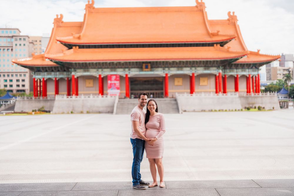 A couple stands in front of National Theater at Liberty Square in Taipei, Taiwan.