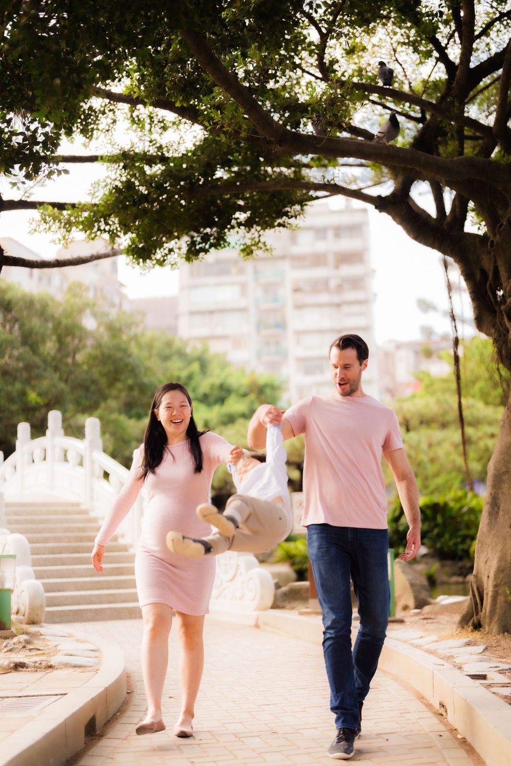 A small family share an intimate moment at CKS Memorial Hall in Taipei.