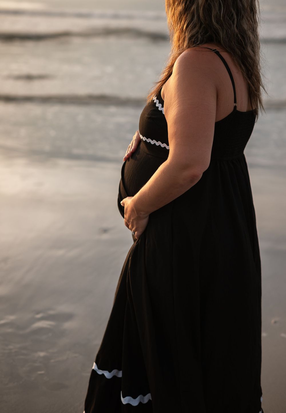 woman facing sunset