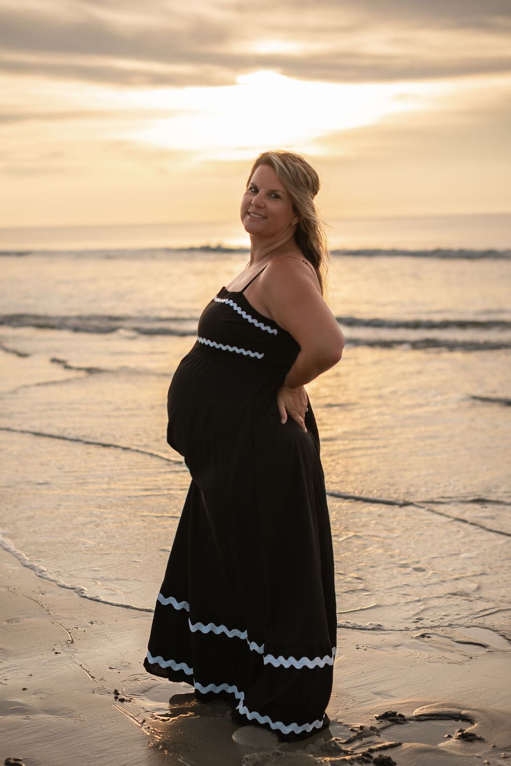 pregnant woman beach sunset