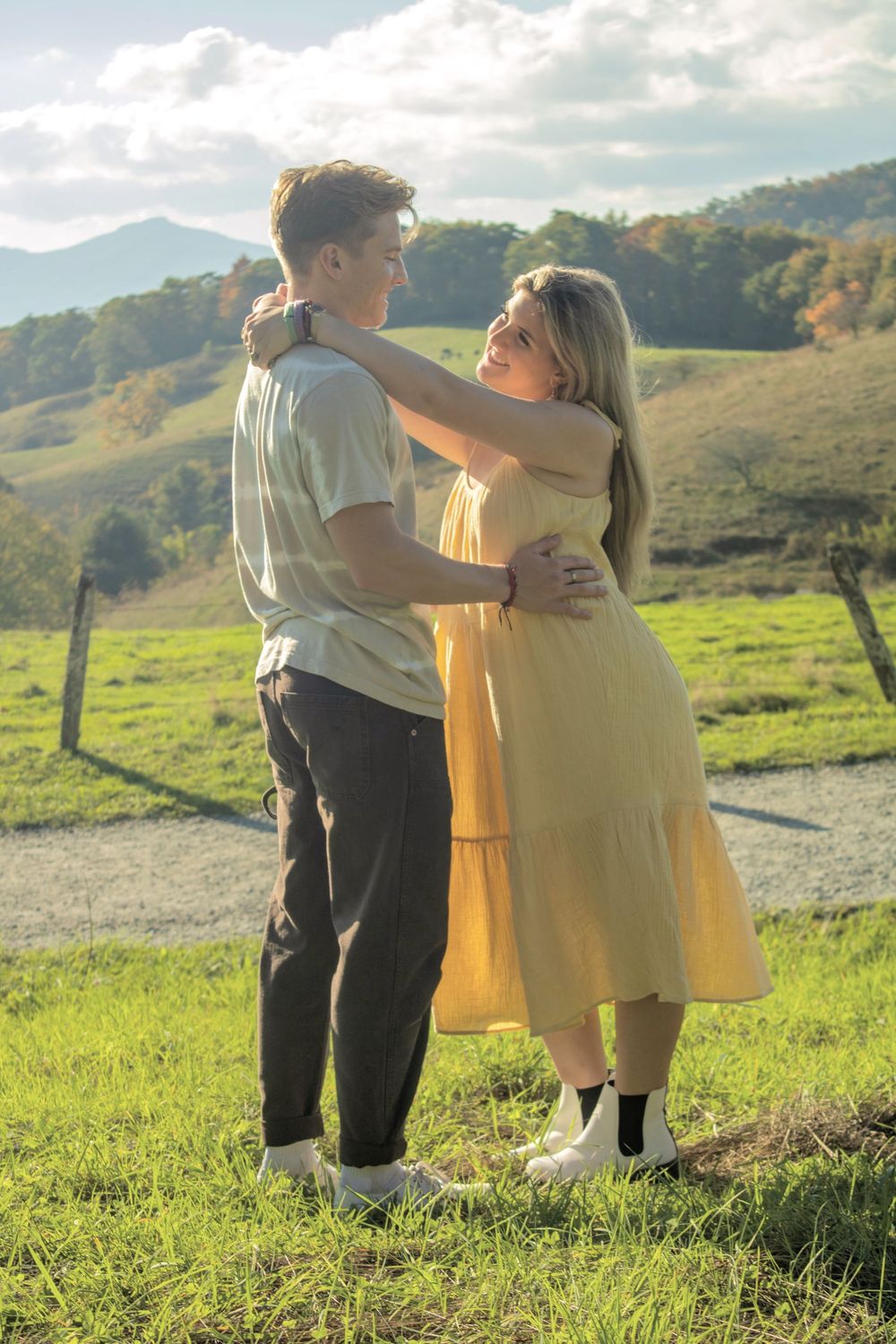 couple dancing in mountains on nature trail