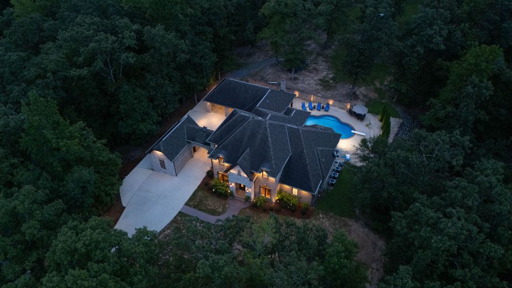 Aerial photo of a home at night. Real estate listing photo