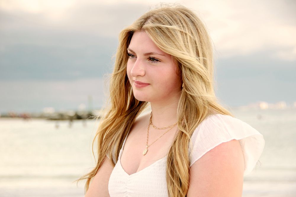side profile senior picture of girl on beach in New Port Richey