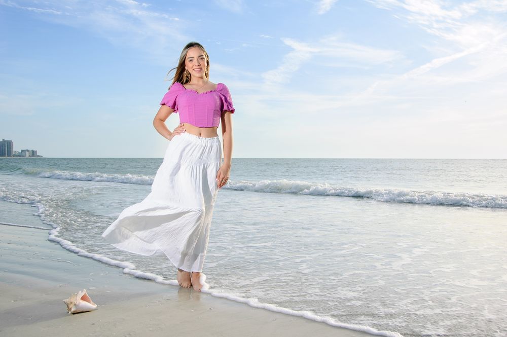 senior portrait of girl standing by water in New Port Richey