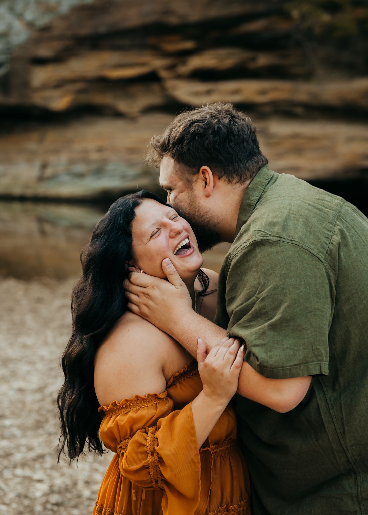 Guy telling his girlfriend funny secrets during photo session with Cheyenne Michelle Photograph, LLC