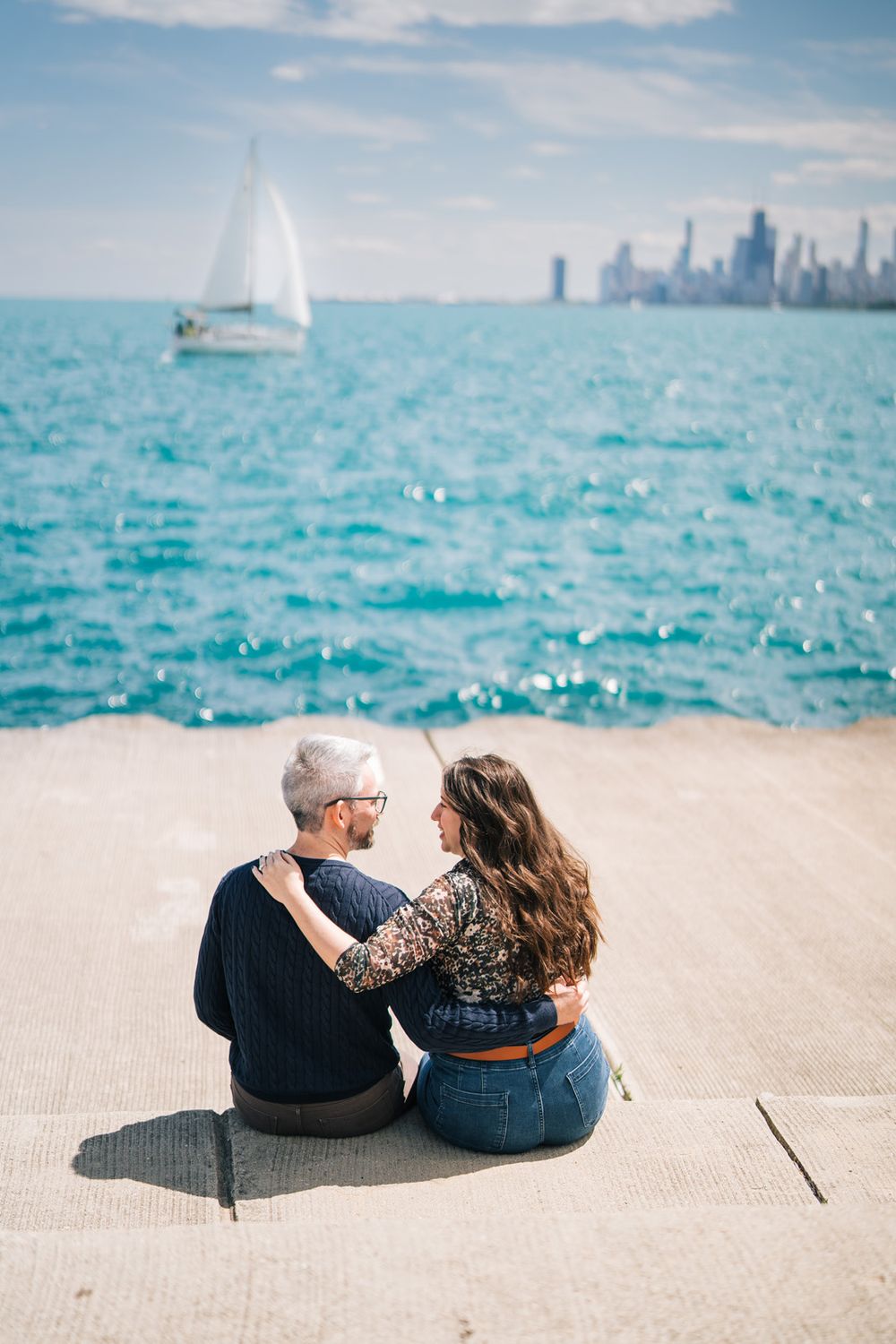 Engagement portraits by Two Birds Photography at Montrose Harbor in Chicago, Illinois.