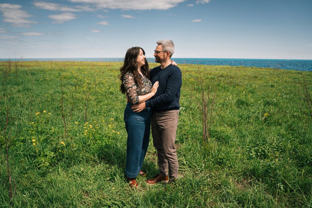 Engagement portraits by Two Birds Photography at Montrose Harbor in Chicago, Illinois.