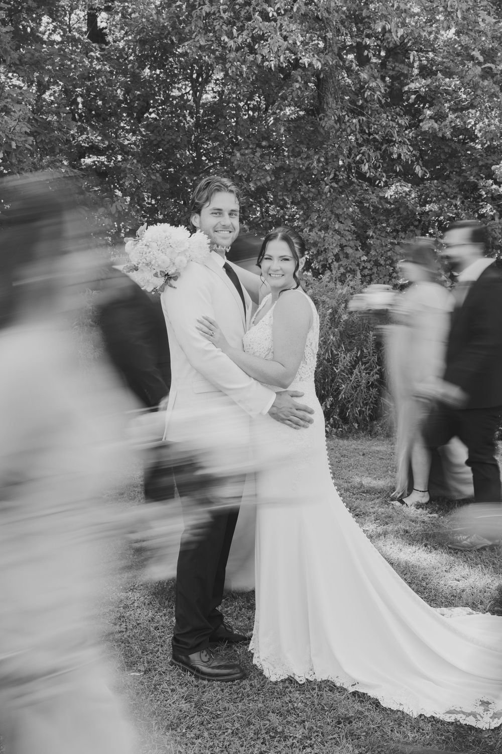 A sequence of motion blur wedding photos shows a couple in white dress spinning and dancing outdoors in a garden setting.