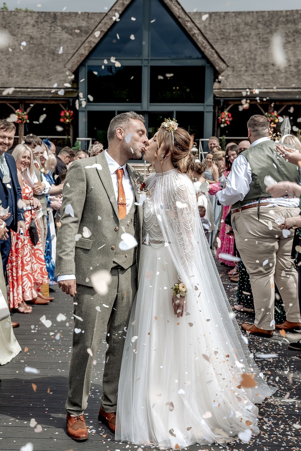 A relaxed natural moment for newly weds during their confetti walk.