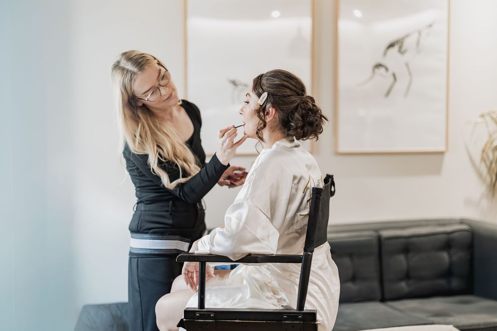Bride to be during make up captured naturally and unobtrusively.