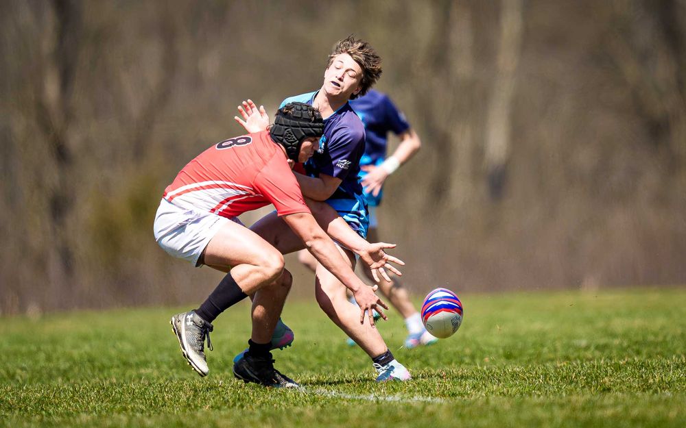 Cumberland Valley Rugby tackles Elizabethtown Blues ball carrier at Old Trolley Line Park, 2026 — SportsFox Photography