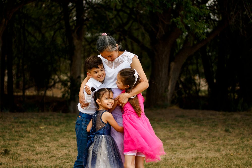 A mother and her children during a family photo session at The League House in Amarillo, Texas