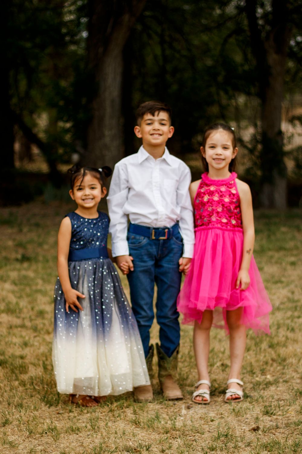 Siblings during a family photo session at The League House in Amarillo, Texas