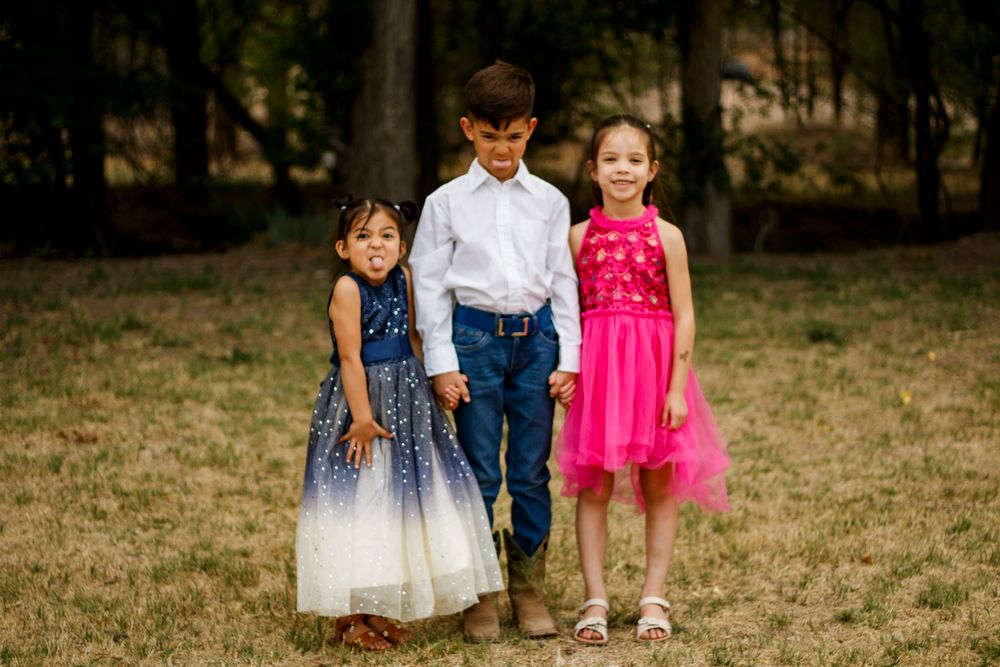 Siblings during a family photo session at The League House in Amarillo, Texas