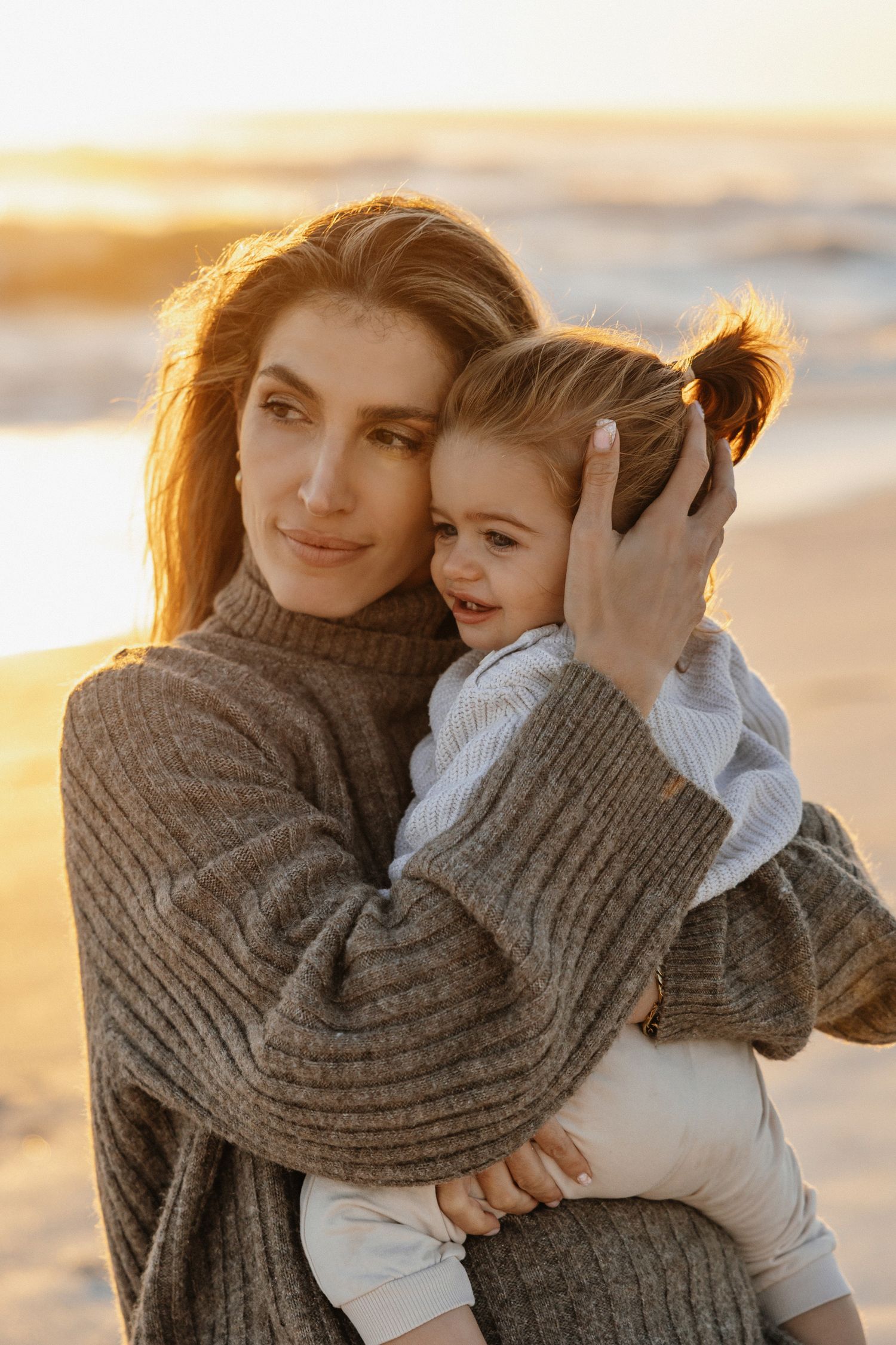 mother and daughter fashion in a close embrace