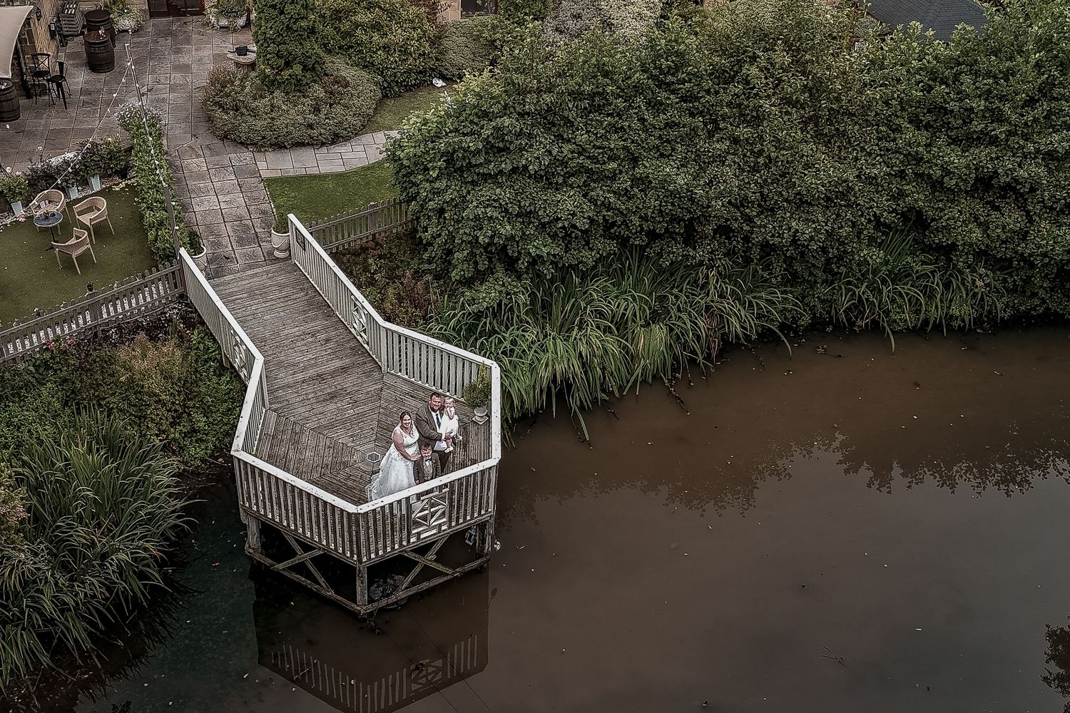 An aerial photo taken by a documentary wedding photographer of the newlyweds.