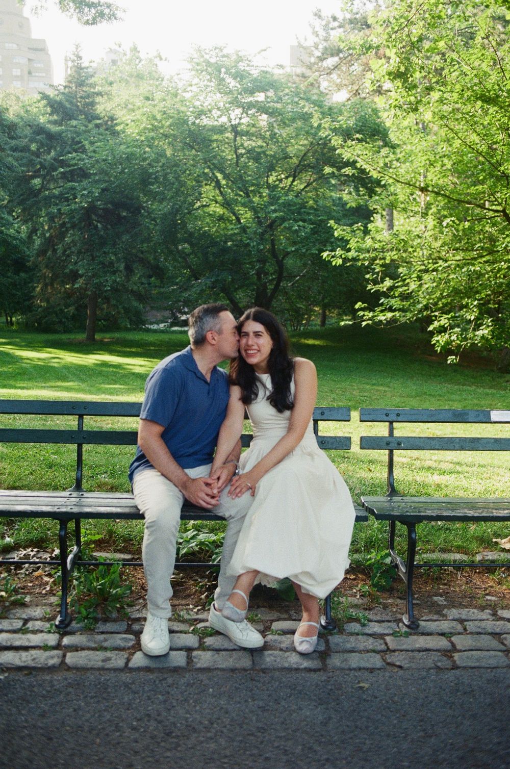 NYC engagement photographer capturing candid couple portraits in Central Park with natural light and film photography