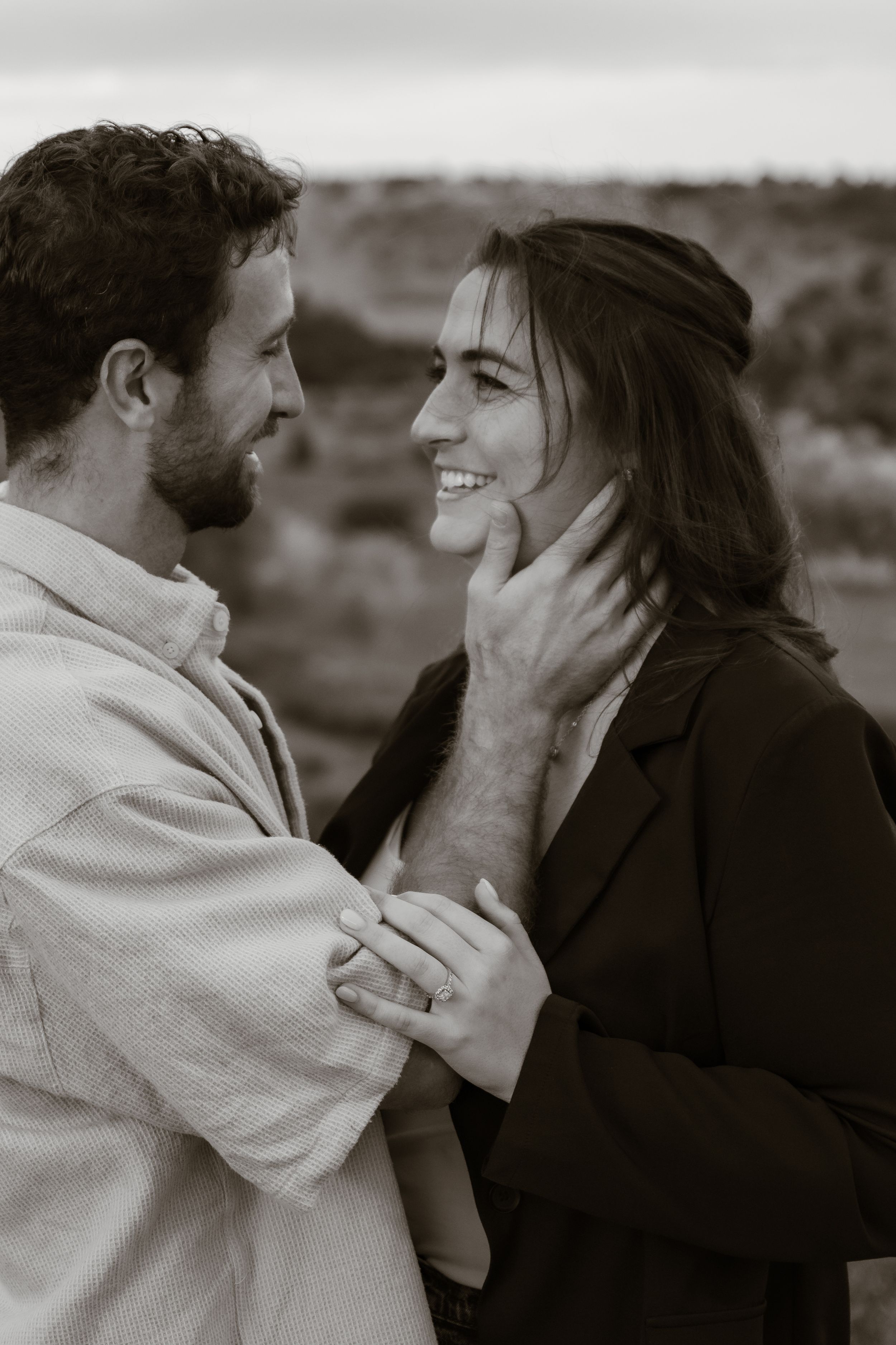 A sequence captures tender moments between two people in black and white.