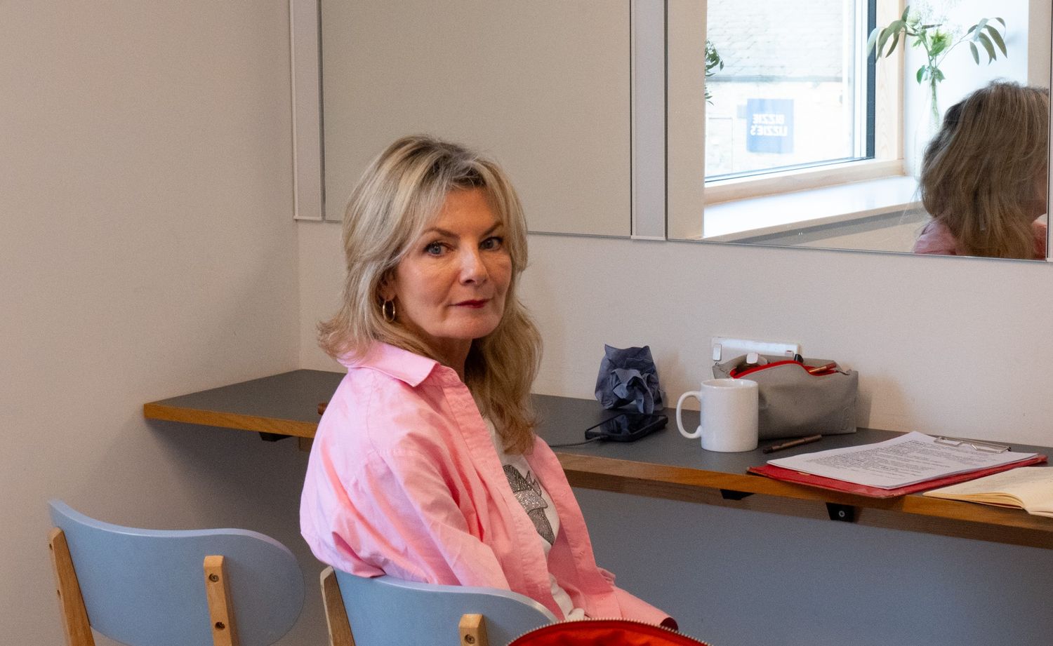 Thoughtful behind-the-scenes portrait photograph of Jo Caulfield.  Photographer is Isobel Hughes Photography in Haworth West Yorkshire.