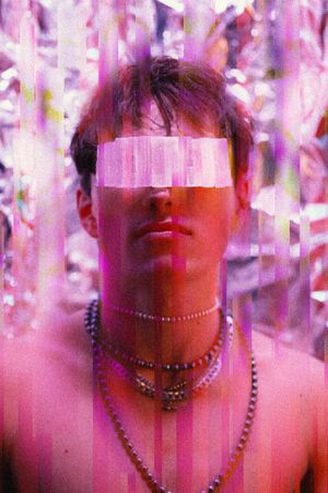 Artistic portrait with pink overlay and beaded jewelry in dreamy lighting.