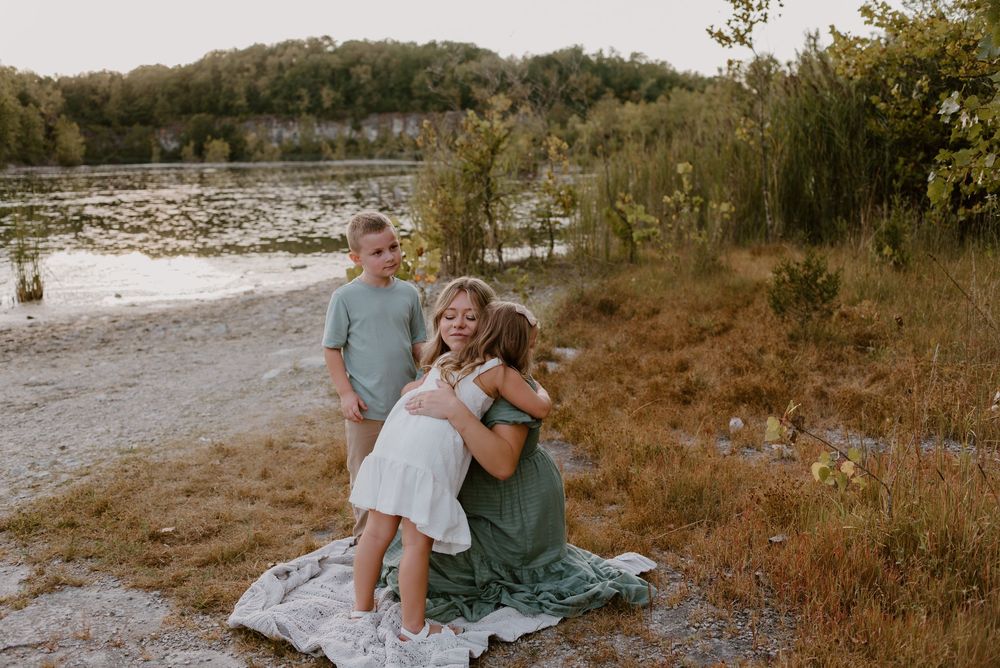 Lifestyle family photos taken in a natural outdoor setting at sunset.