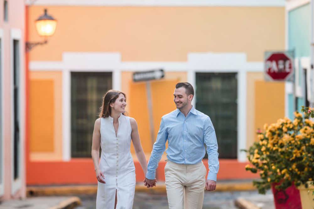 Couple walking through colorful street in Old San Juan Puerto Rico engagement session