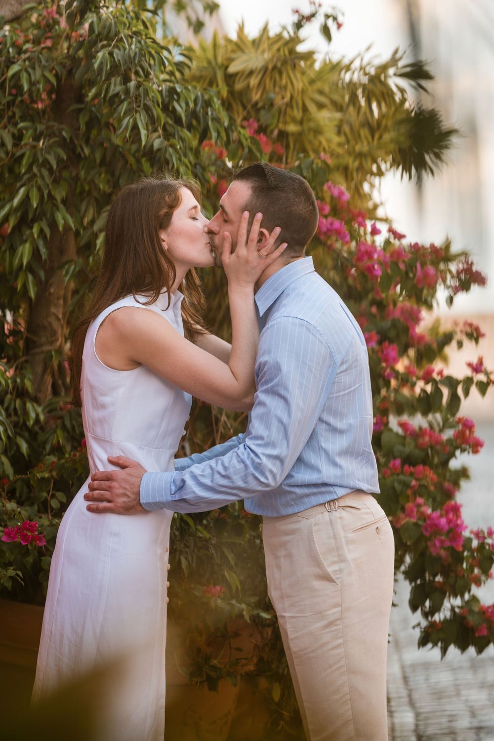 Couple embracing near colorful garden in Old San Juan Puerto Rico engagement session
