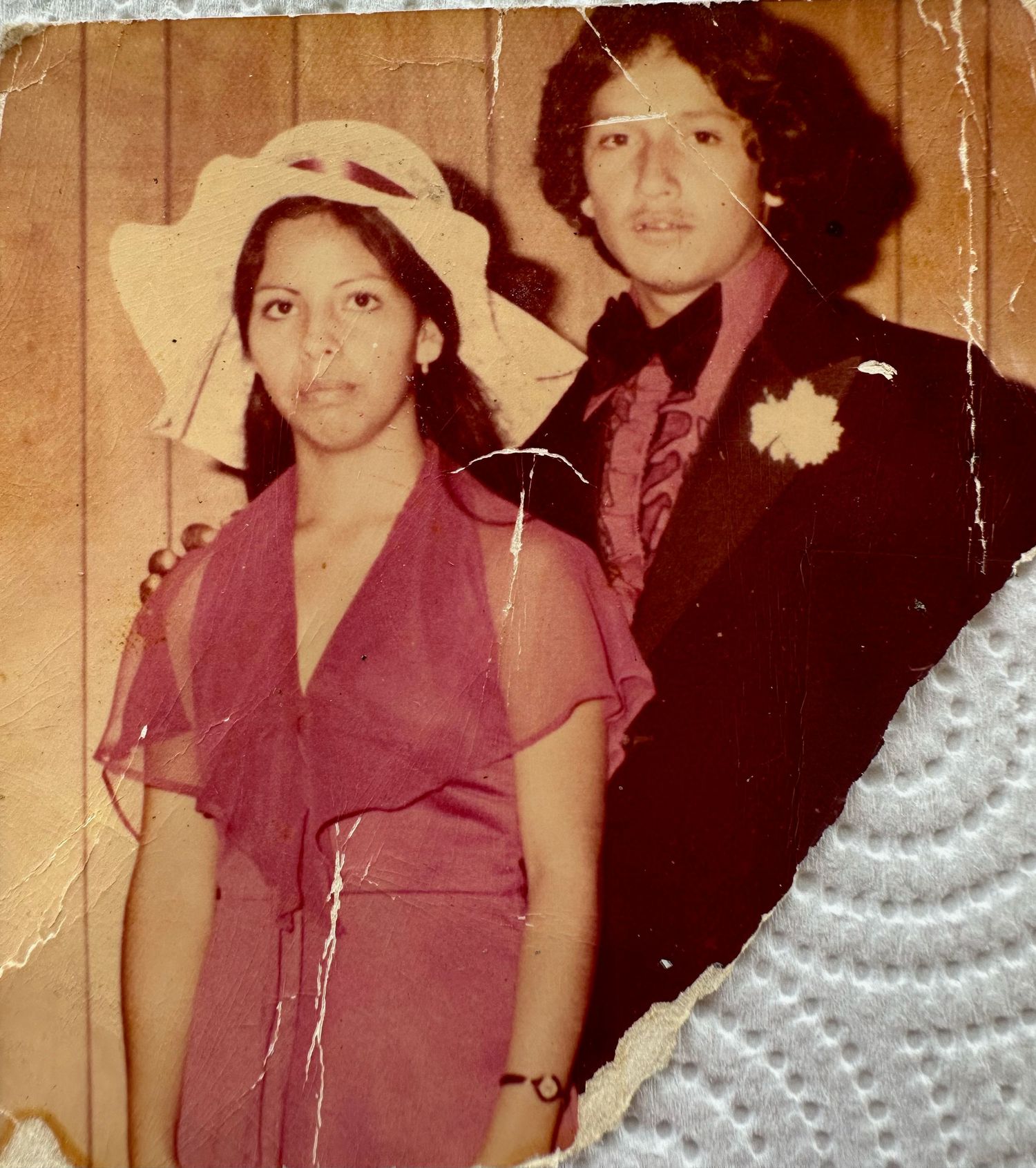 Three vintage photos from the 1970s show people in burgundy outfits posing against wood paneled walls.