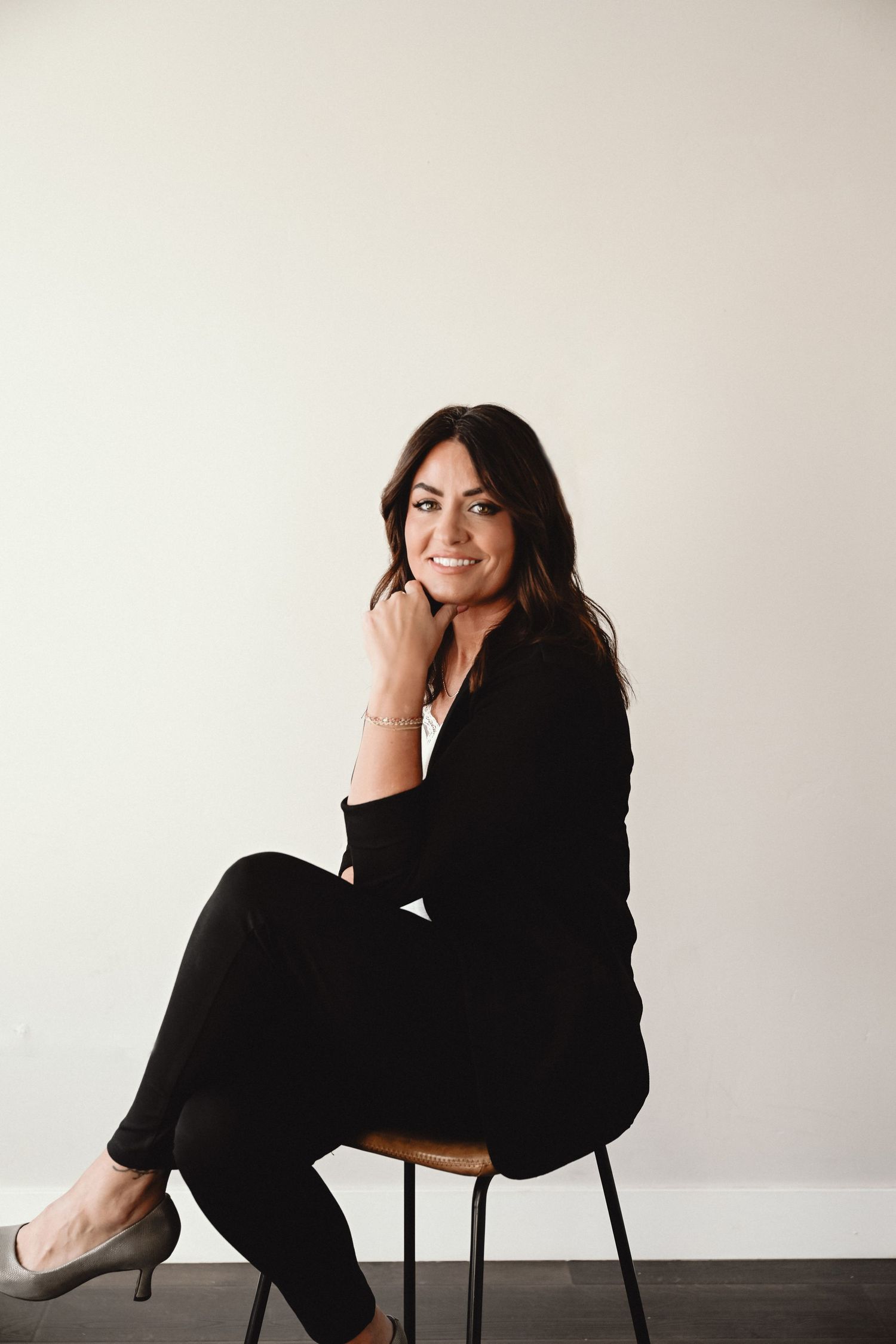 Oakstream Photography with Allstate Insurance in Logan Utah featuring branding pictures of woman in black suit.