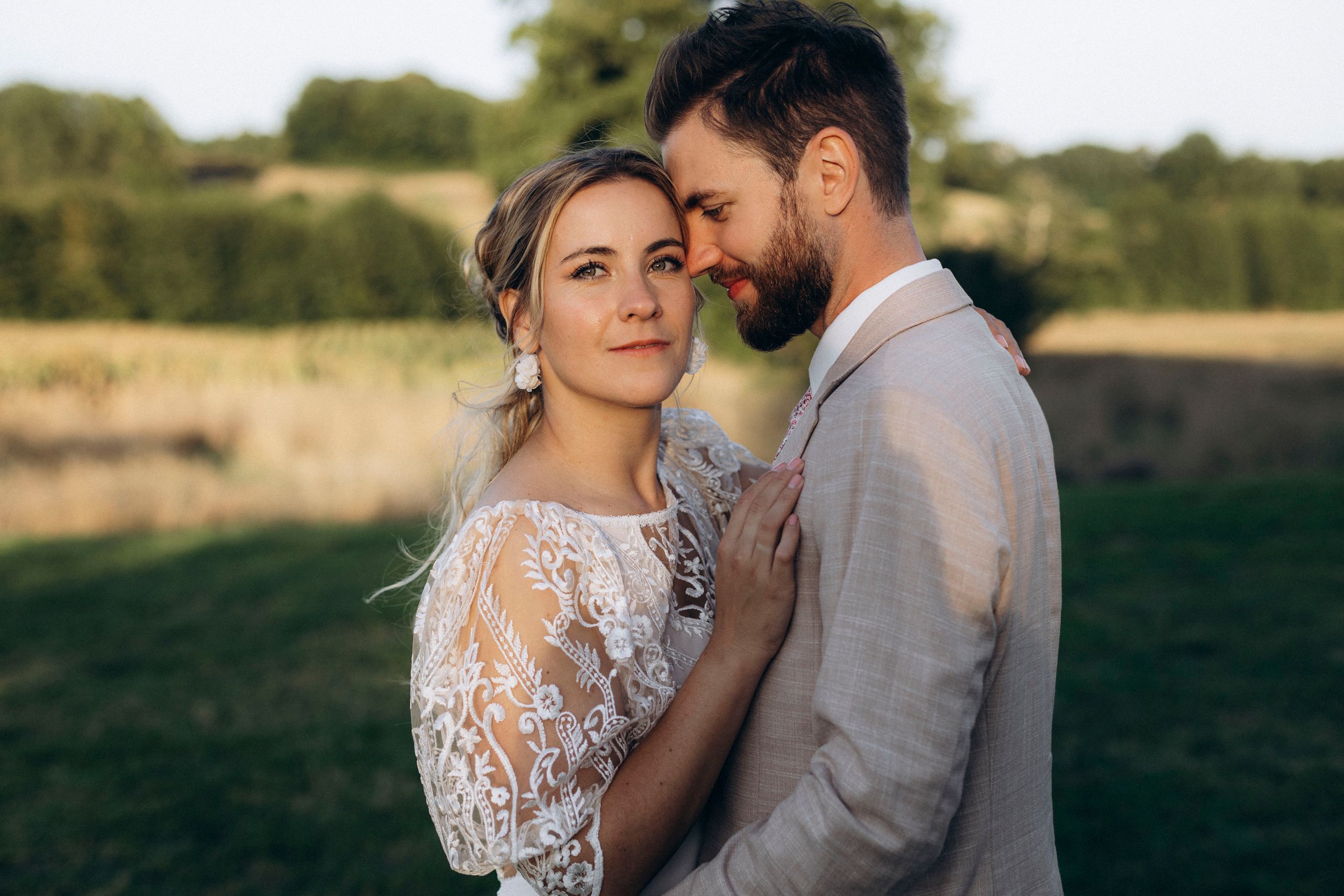 A romantic dance silhouette under stone archways with warm lighting.