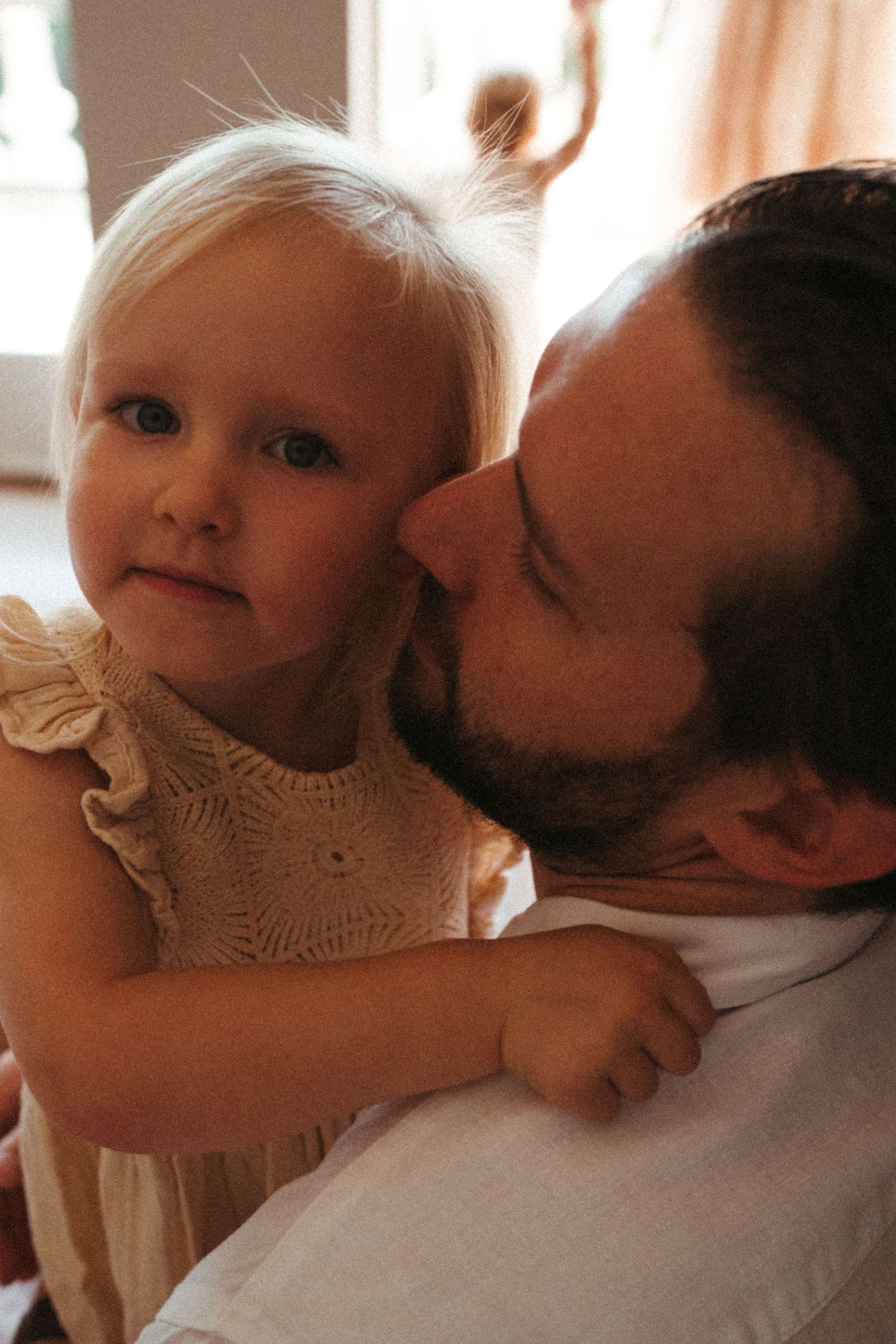 Intimate close-up portraits showing tender moments in warm natural lighting.