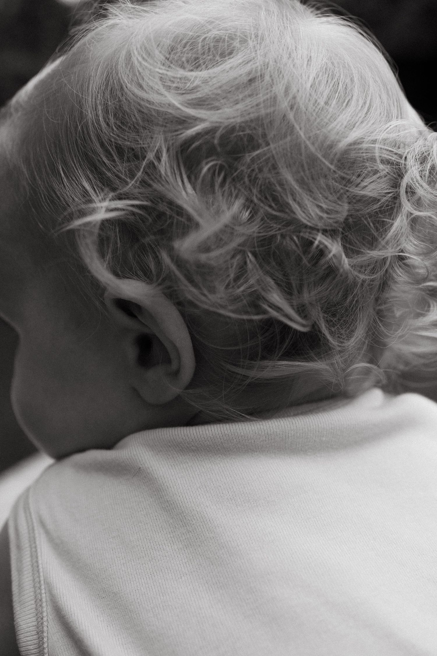 Black and white close-up series showing soft wisps of light-colored hair.