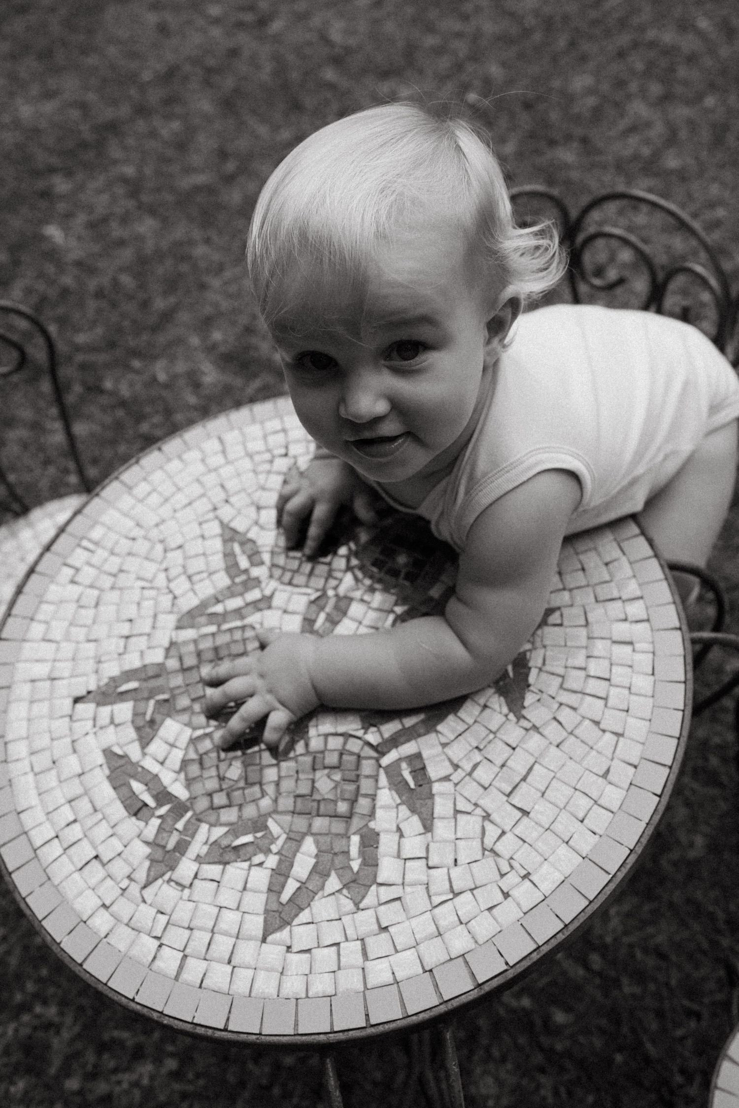 Close-up shots of interaction with a decorative mosaic table surface.