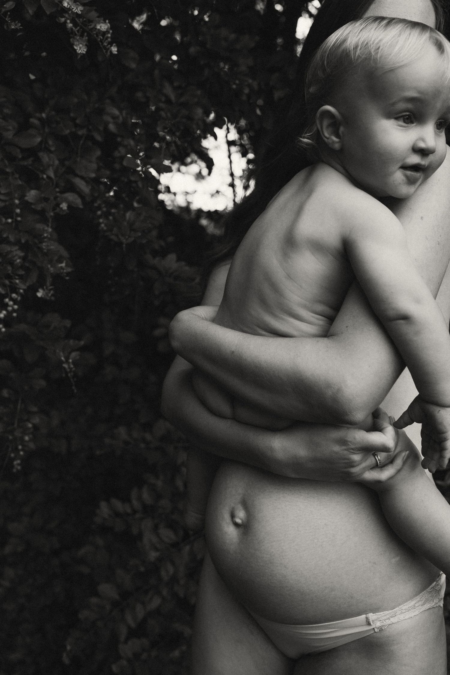 Black and white artistic portraits showing tender embraces.