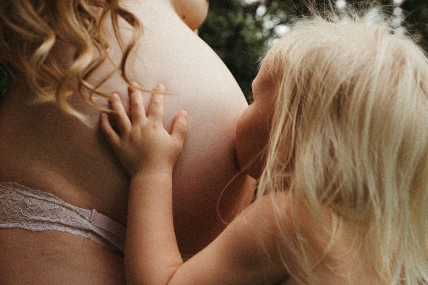 A series of intimate close-up shots showing tender moments between a couple in warm natural lighting.