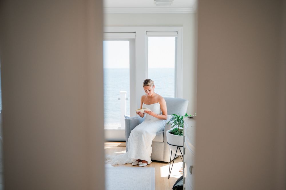 Minimalist interior space with neutral tones and large windows letting in natural light.